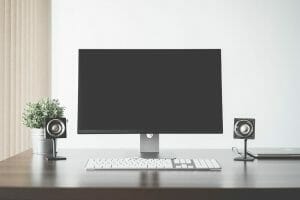 monitor and speakers on the desk