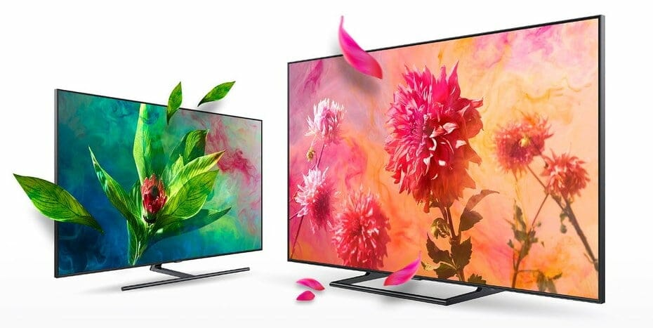 two flat monitors displaying colorful flowers