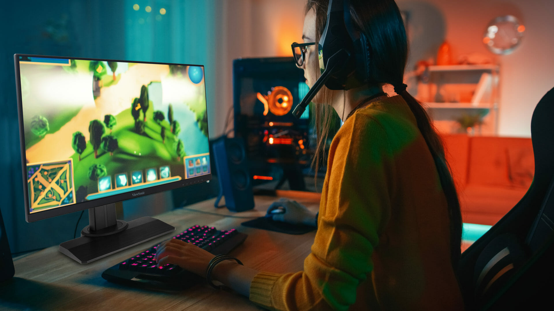 A girl playing a game on a ViewSonic monitor