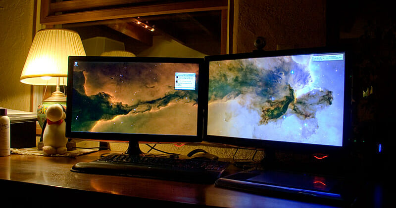 two monitors on the table