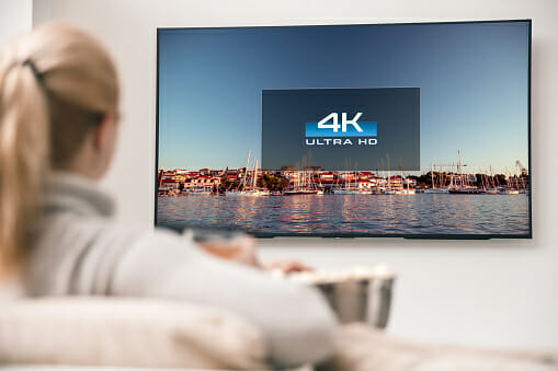 Woman watching a 4K TV