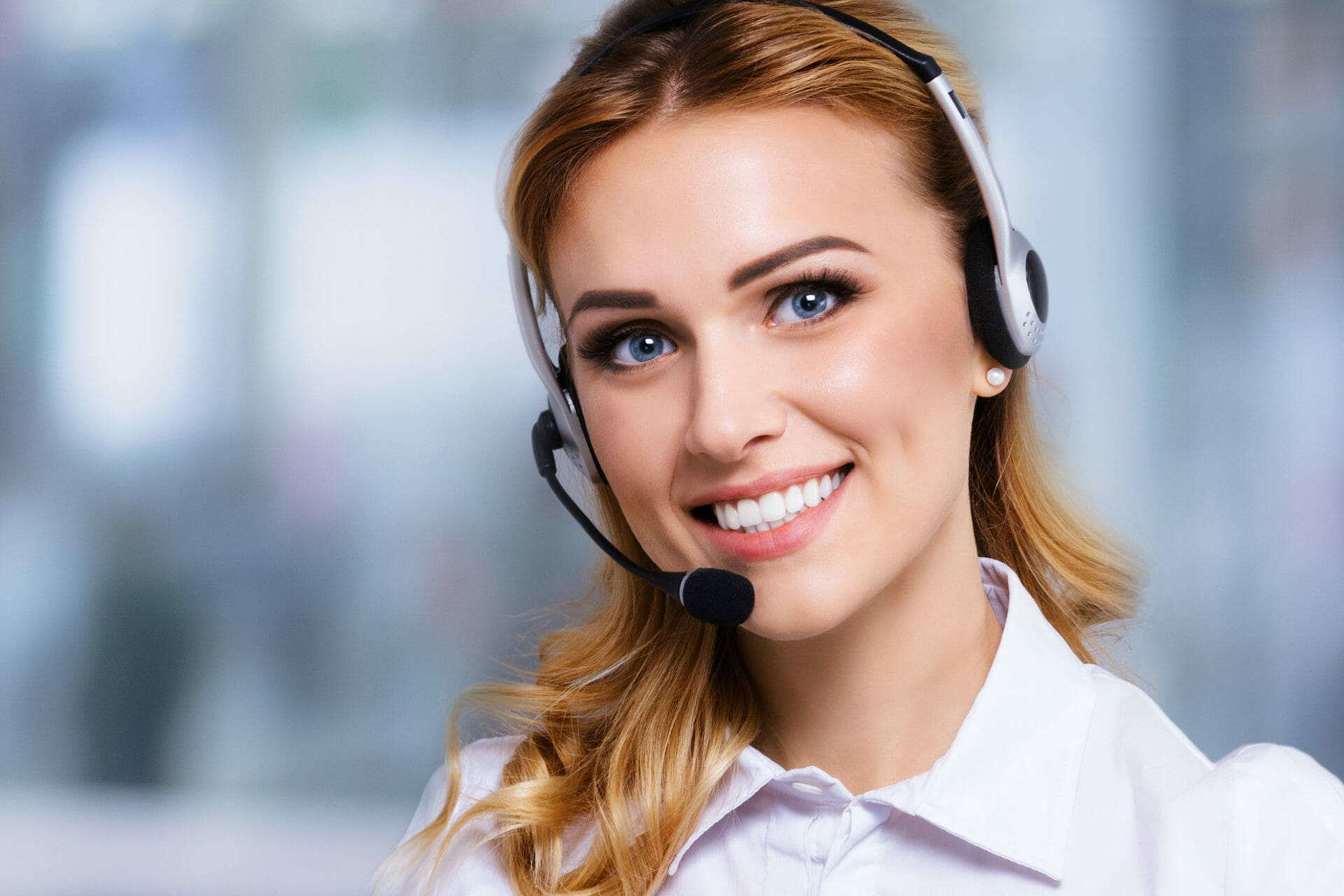 Smiling woman in a call center