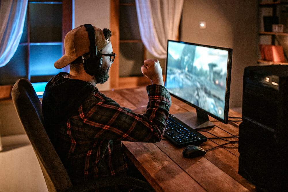 Gaming guy holding his fist up