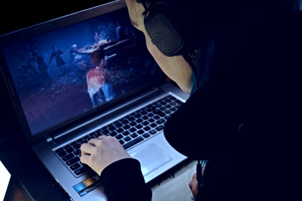 a person playing a video game on laptop