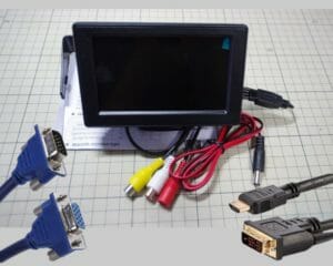 a monitor and various cables