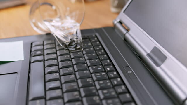 Spilled water on a laptop keyboard