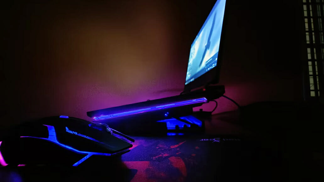a gaming laptop and a mouse