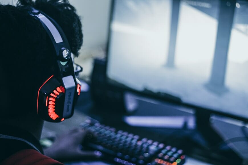 a person with headphones playing a game