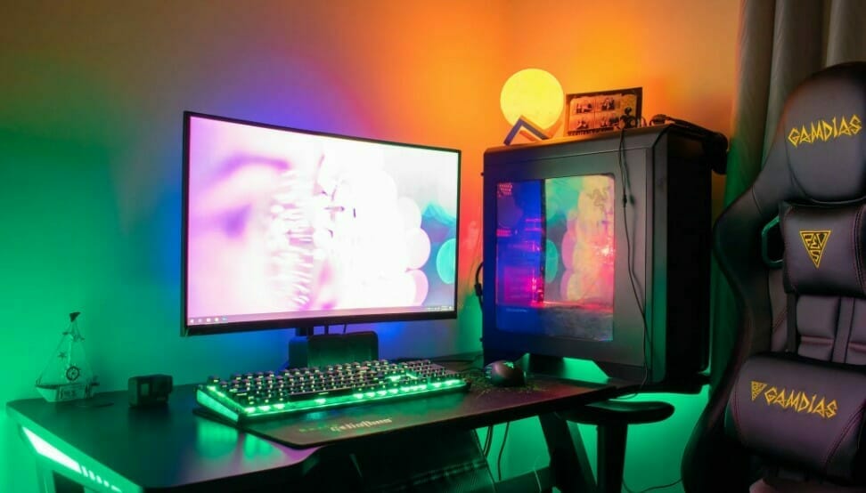 PC with a monitor emitting rainbow lights