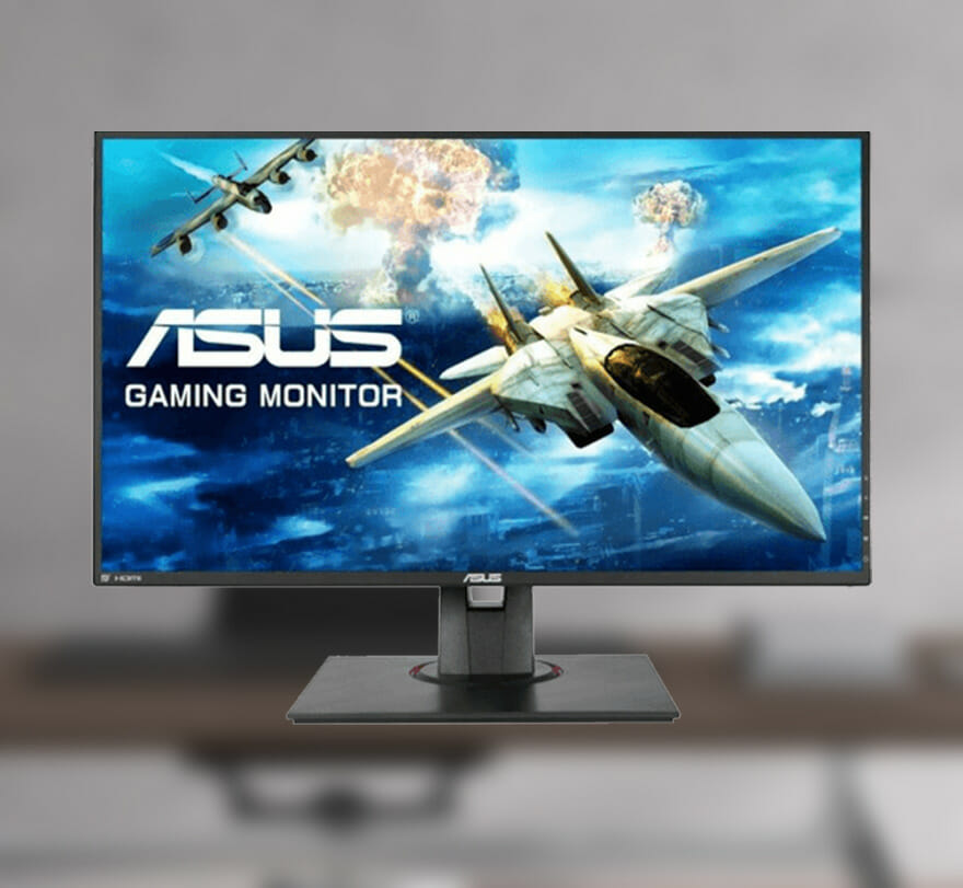 asus monitori in front of a blurred table with a cool background