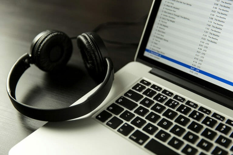 closeup of laptop and headphones on it