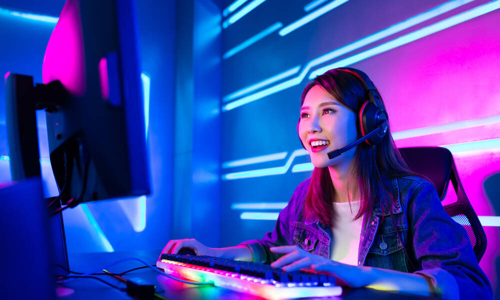 A girl smiling and wearing headphones