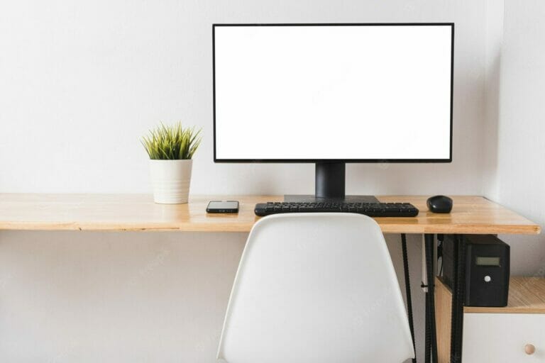 White computer screen on a table