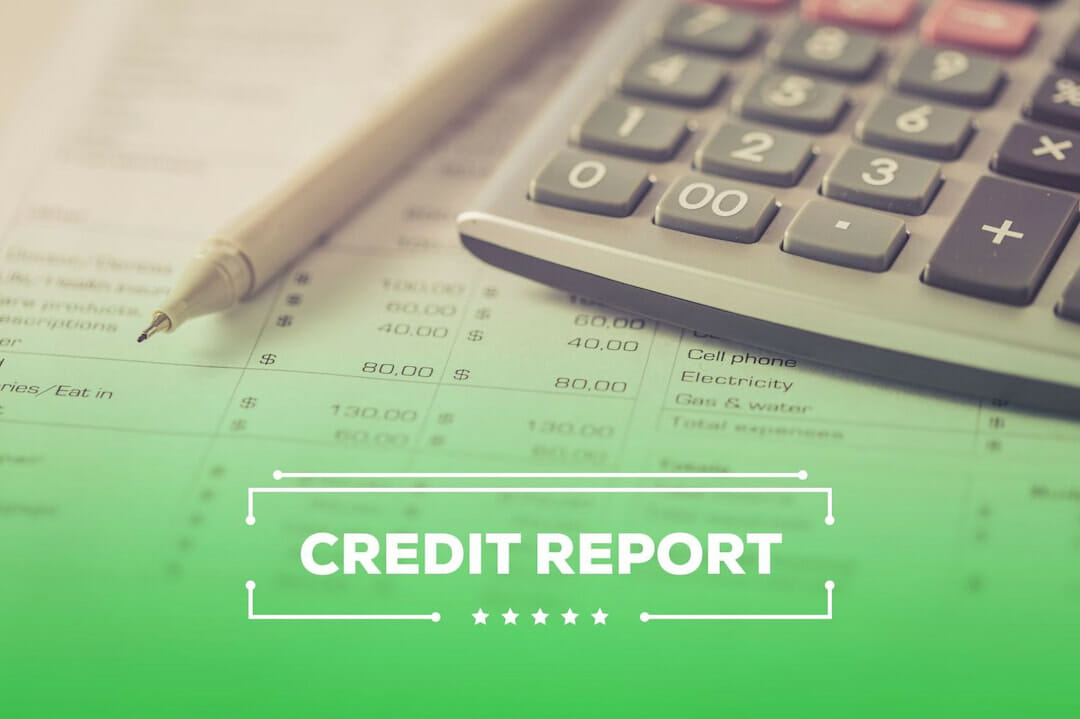 Credit report, a pen and a calculator